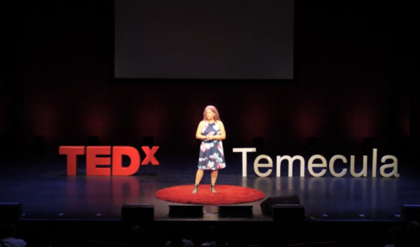 Diane Strand speaking at a creative arts event, empowering students and entrepreneurs through JDS Creative Academy and DigiFest® Temecula in California.